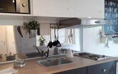a kitchen with a sink and a counter top at L'Attico di San Saba in Rome