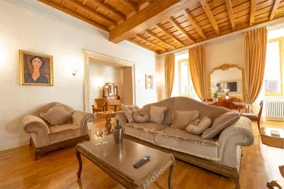 a living room with a couch and a table at Pantheon Suites in Rome in Rome
