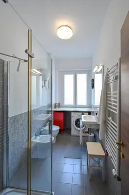 a bathroom with a shower and a toilet and a sink at Dodo House in Rome