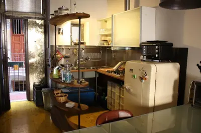 a kitchen with a refrigerator and a counter top at Design Loft a Roma in Rome