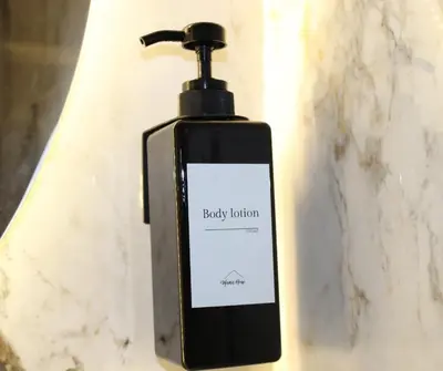 a bottle of body lotion sitting on a wall at Mama House 2 - Trastevere in Rome
