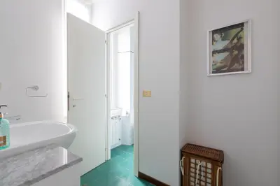 a bathroom with a tub and a sink at Suite Bormida - Coppedè in Rome