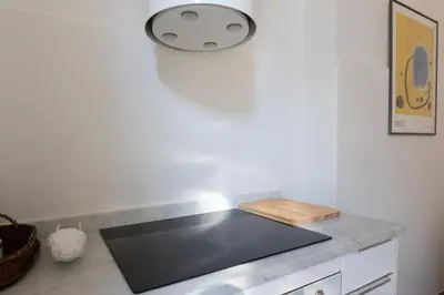 a kitchen with a sink and a counter top at Suite Bormida - Coppedè in Rome