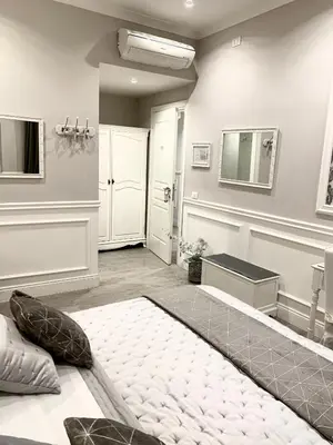 a large room with a bed and a mirror at Charme & Chic Prestige in Rome