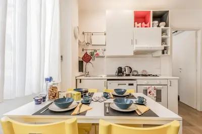 a kitchen with a table with two bowls on it at True Colors Vatican Home in Rome