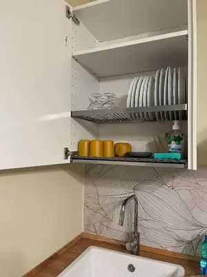 a kitchen with a sink and a shelf with dishes at Barbi's Home- Colli Albani Roma in Rome