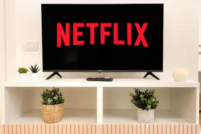 a television with the netflix sign on top of a table at Sky Hub21 in Rome