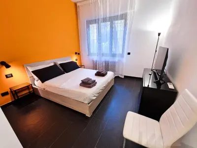 a bedroom with a bed and a television in it at Conca D'oro Colors - Metro & WI-FI in Rome
