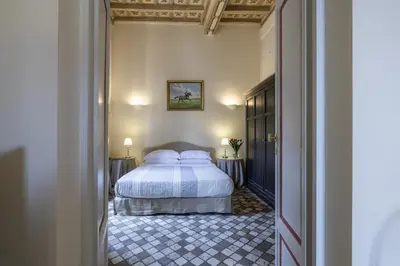 a bedroom with a bed with two pillows at Piazza della Maddalena view in Rome