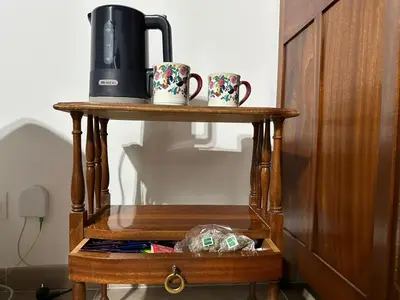a shelf with two mugs and a coffee maker on it at Casa Ludovica Trastevere in Rome