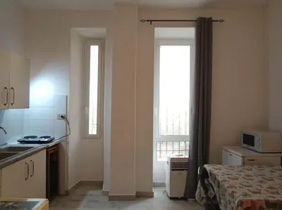 a kitchen with a sink and a window in a room at Monolocale vicino metro Libia in Rome