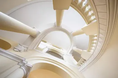 an overhead view of a spiral staircase in a building at Il Nido -Cinema HD & Relax Space in Rome