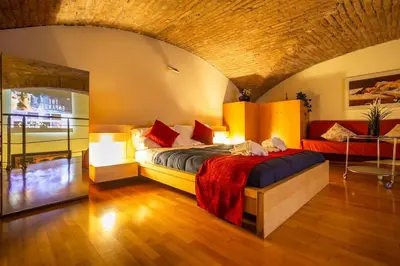 a bedroom with a large bed in a room at Il Nido -Cinema HD & Relax Space in Rome