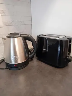 a black and silver toaster sitting on a counter at Luminoso a due passi da Trastevere in Rome