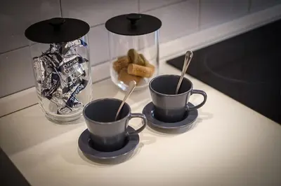 two cups on a table with two spoons at ht vicolo 6 bilo in Rome