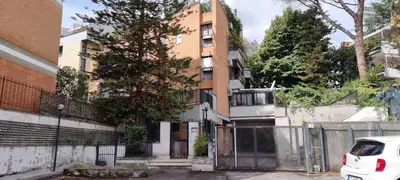 an apartment building with a fence in front of it at Er Core Nostro in Rome