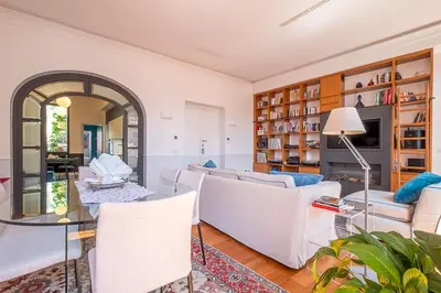 a living room with a couch and a table at HT Borromini Penthouse in Rome