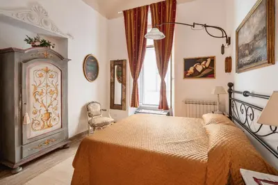 a bedroom with a bed and a window at Stefano Soffici Domus Trastevere in Rome