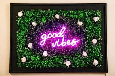 a picture of a good wishes sign with green plants at Eleganza e Confort nel Cuore dei Parioli in Rome