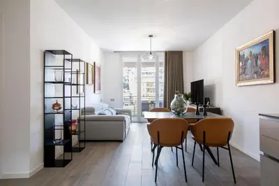 a living room with a table and chairs at Sky Luxury in Rome