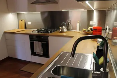 a kitchen with a sink and a stove at Casa Argia in Rome