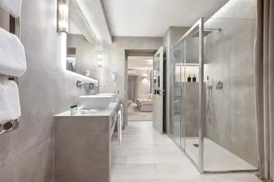 a bathroom with a sink and a shower at Terrace Pantheon Relais in Rome