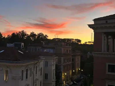 a view of a city at sunset at CBMC - Couldn't Be More Central in Rome