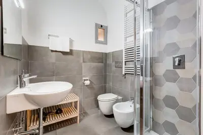 a bathroom with a sink and a toilet and a shower at FaMa - Le Volte in Rome