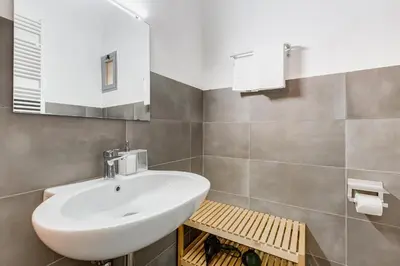 a bathroom with a white sink and a mirror at FaMa - Le Volte in Rome