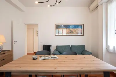 a dining room with a wooden table and chairs at Carpegna Park Apartment by Cornelia subway in Rome