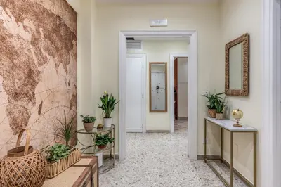 a hallway with potted plants on the walls at Vatican Cartographer in Rome