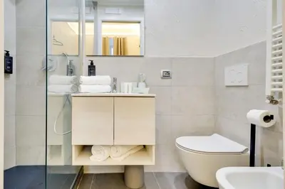a bathroom with a toilet and a sink at V Collection Rome Jubilee Guest House in Rome