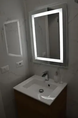 a bathroom with a sink and a mirror at Casa Erminia in Rome