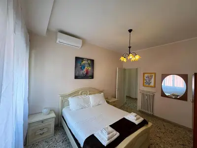 a bedroom with a bed and a window at Vintage Charm Apt in Aurelio in Rome