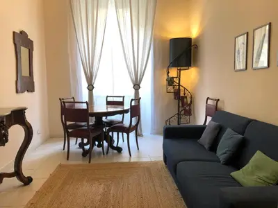 a living room with a couch and a table at Domus Ottavia in Roma in Rome