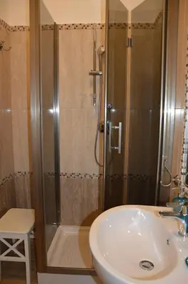a bathroom with a shower and a sink and a tub at Ad Maiora bb Roma Musei Vaticani in Rome