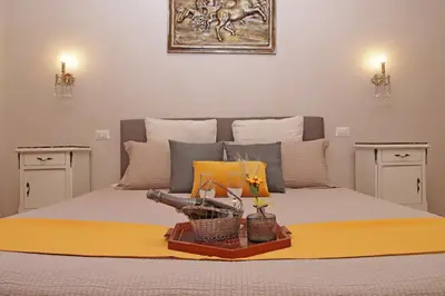 a bedroom with a bed with a weapon on it at dolce casa colosseo 2 in Rome