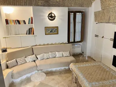 a living room with a couch and a table at Casa Cavour in Rome
