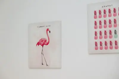 a pink flamingo book and a bunch of pink nails at Pandolfo Apartment in Rome