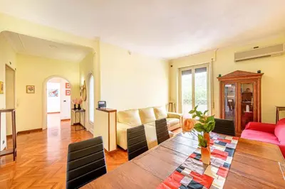 a living room with a couch and a table at Viale Mazzini Big Apartment in Rome