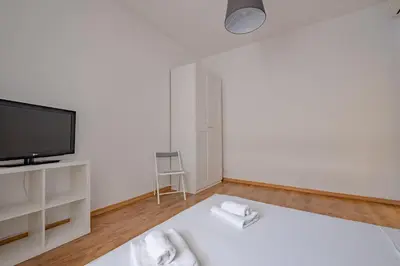 a white room with a tv and a bed at Apartment B5 in the center of Rome WiFi and AC in Rome