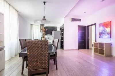 a kitchen and dining room with a table and chairs at Charme & Luxe 2 bedroom apartment City Center in Rome