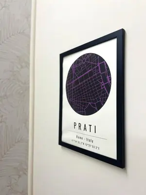 a framed picture of a purple orb on a wall at Vicolo 35 in Rome