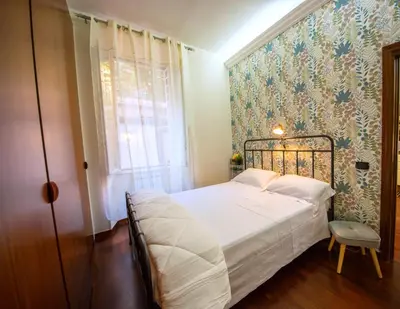 a bedroom with a bed and a window at Vicolo 35 in Rome