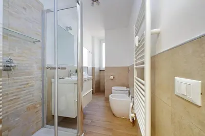 a bathroom with a toilet and a sink and a shower at Doria in Rome
