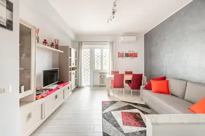 a living room with a couch and a television at New and beautiful house in the heart of Rome in Rome