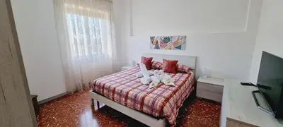 a bedroom with two stuffed animals sitting on a bed at Barbara Sweet Home - Appartamento Intero in Rome
