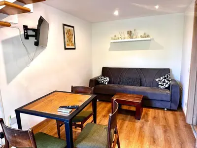 a living room with a couch and a table at Casa Marlon Pietralata in Rome