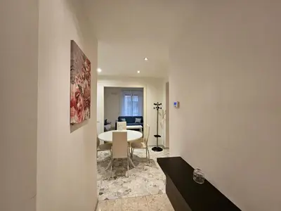 a living room with a table and a dining room at Be Your Home - Isabella Bright Apartment in Rome