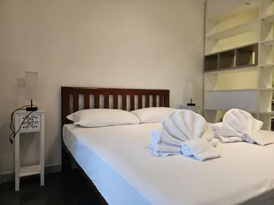 a bedroom with a bed with towels on it at Be Your Home - Isabella Bright Apartment in Rome